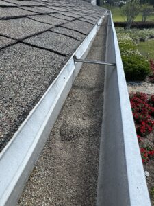 Gutters with shigle grainulas before Integrity Roof Services Umatilla, FL 32784
