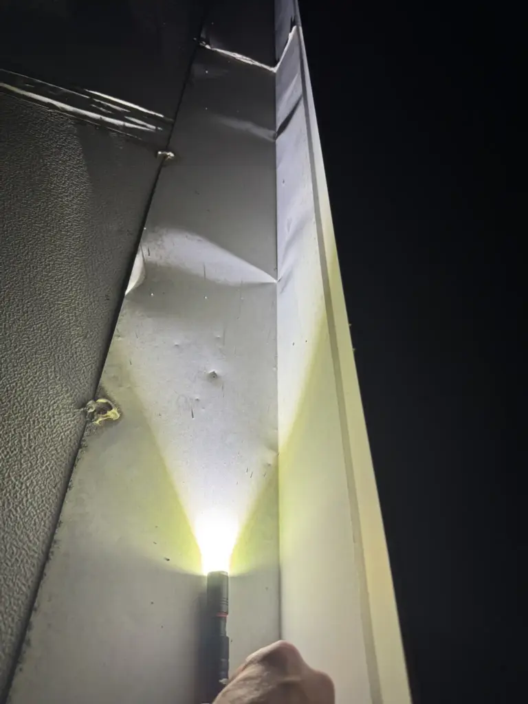 metal flashing hail damage night inspection 6