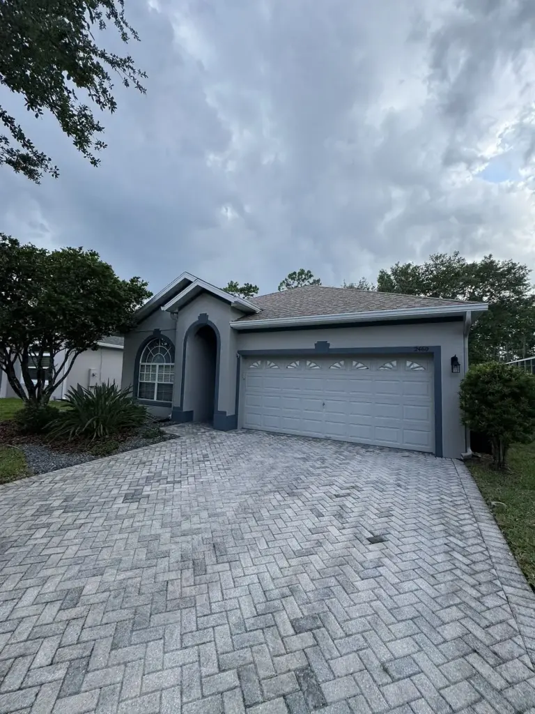 Before roof photo of front elevation showing Atlas Pinnacle Pristine Coastal Granite shingles installed by Integrity Roof Services in Orlando, FL.