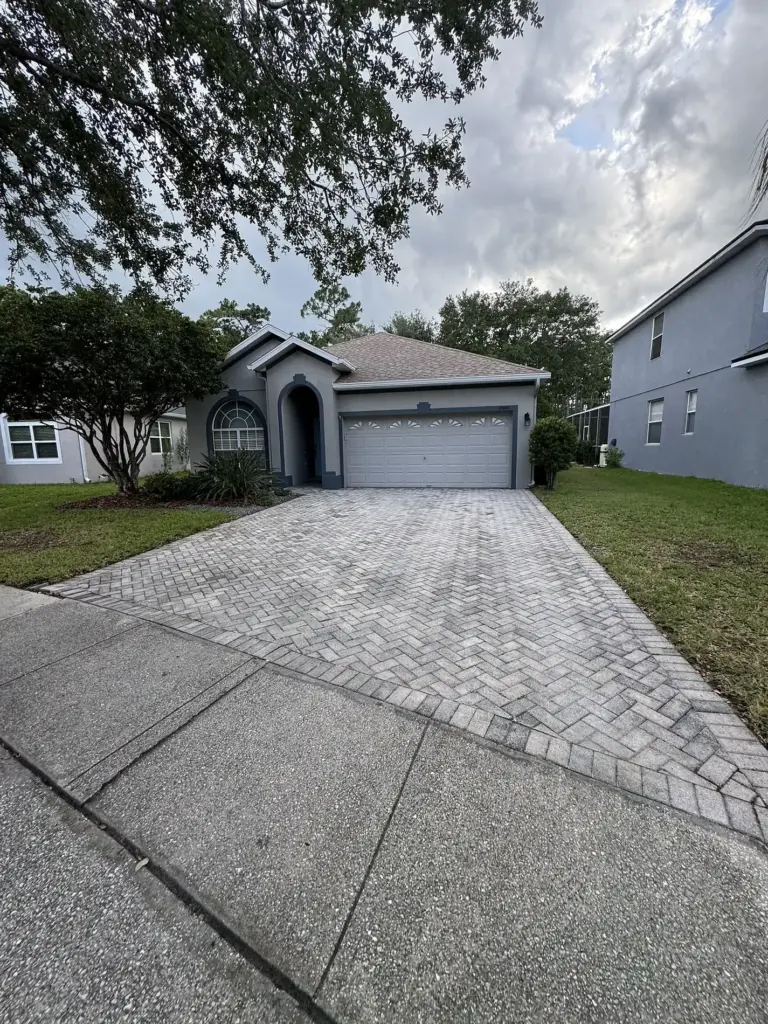 Roofing Projects FL 22 Before roof photo of rear elevation showing Atlas Pinnacle Pristine Coastal Granite shingles installed by Integrity Roof Services in Orlando, FL.