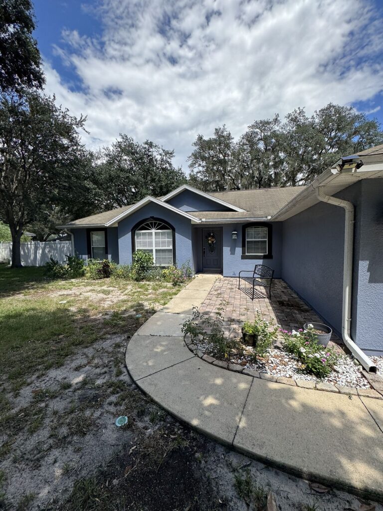 Roofing Projects FL 2 “Before roof replacement in Longwood, FL — storm-damaged asphalt shingles showing wear and granule loss before Integrity Roof Services inspection.”