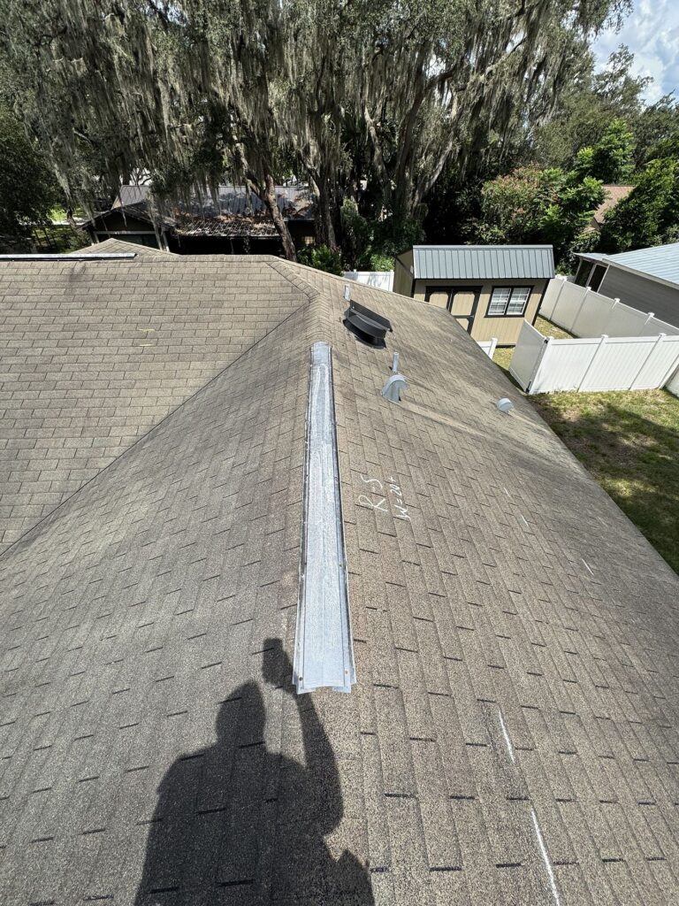 Roofing Projects FL 5 Roof inspection in progress before replacement — Integrity Roof Services assessing storm damage in Longwood, FL.”