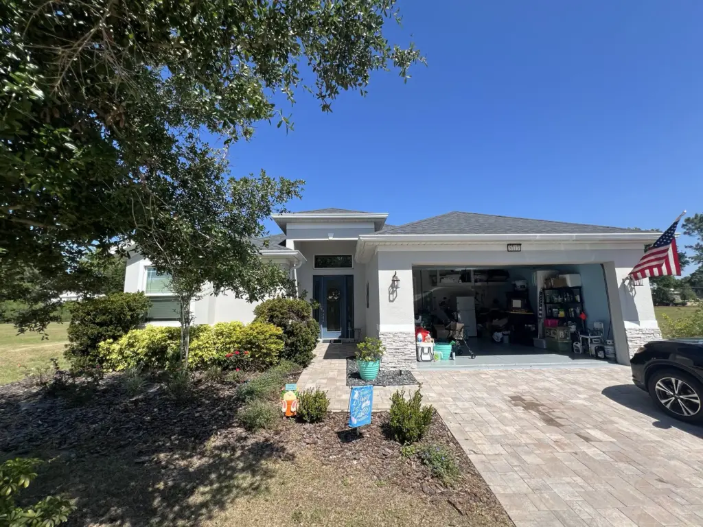 Roofing Projects FL 9 Front entry showing home exterior and worn roofing system