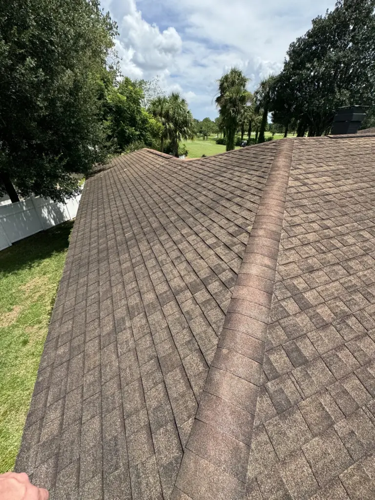 Integrity Roof Services assessment photo showing damaged shingles and roof wear before restoration.