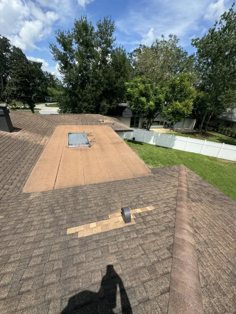 Roof inspection photo documenting wind and storm wear on a Winter Park home prior to Atlas Pinnacle replacement.