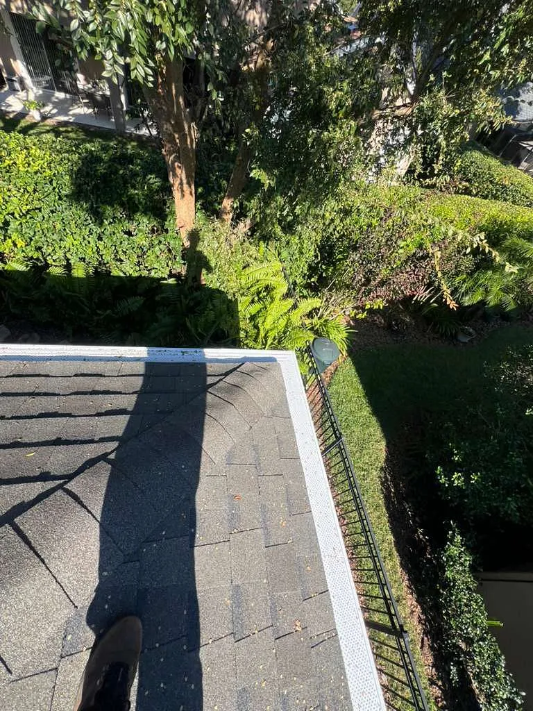 Severe Hail-Damaged Roof Replacement in DeLand, FL 10 New architectural shingle roof paired with fresh gutter system and soffit installation following extreme hail damage in DeLand, Florida.