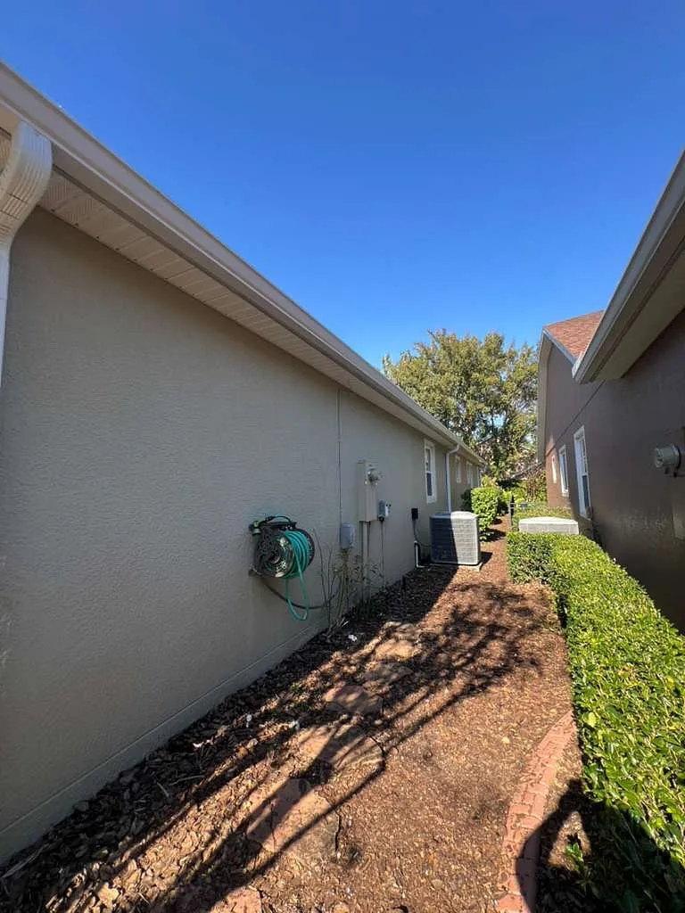 Severe Hail-Damaged Roof Replacement in DeLand, FL 8 Post-hail replacement photo highlighting seamless gutter installation and new soffit supporting long-term roof performance in DeLand
