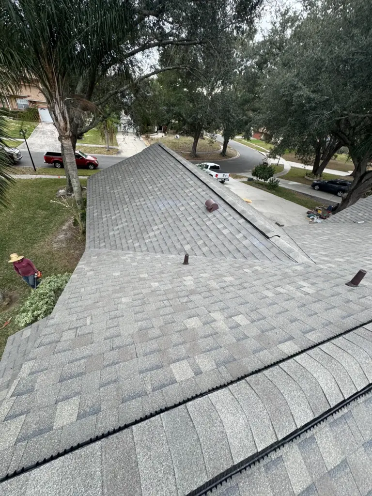 Freshly installed architectural shingles creating a clean, sealed, and leak-free roofing system.