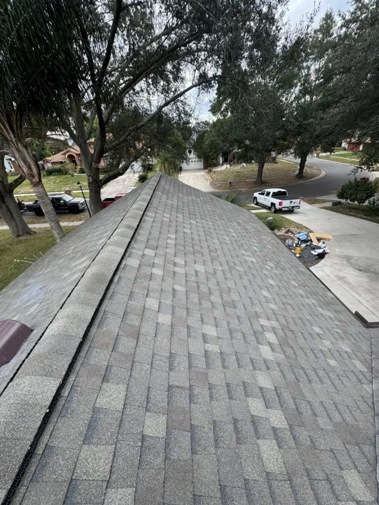 Finished roof surface showing uniform shingle alignment and professional craftsmanship.