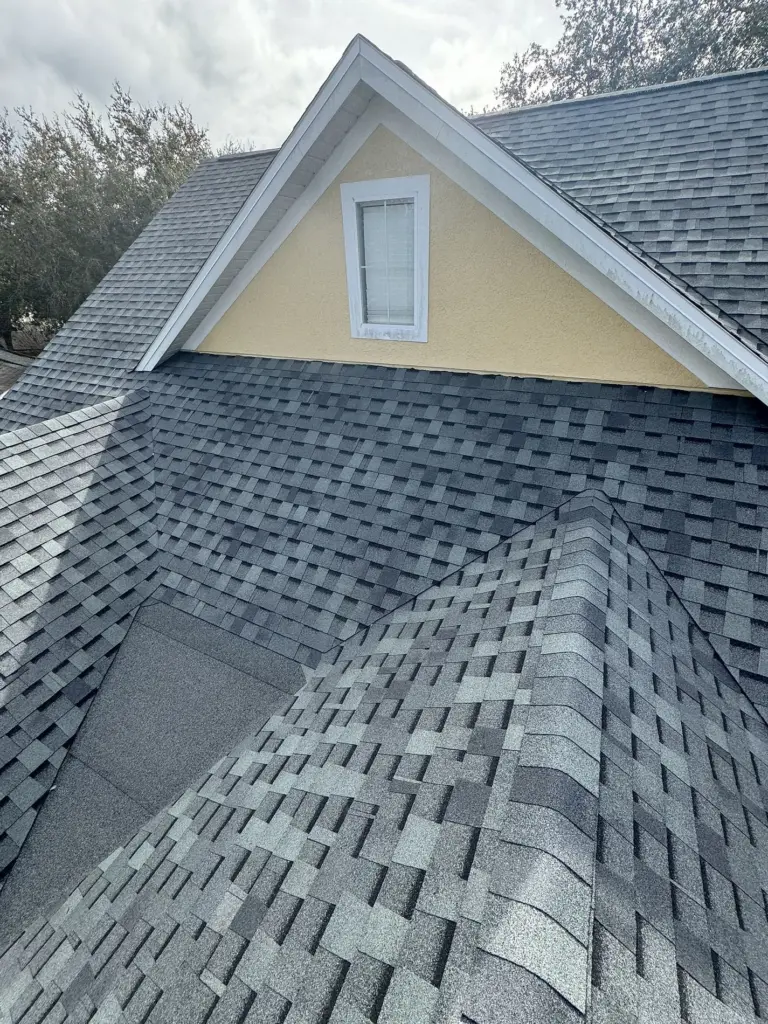 Ridge cap shingles professionally installed on a completed roof in Iron Gate, Leesburg, FL