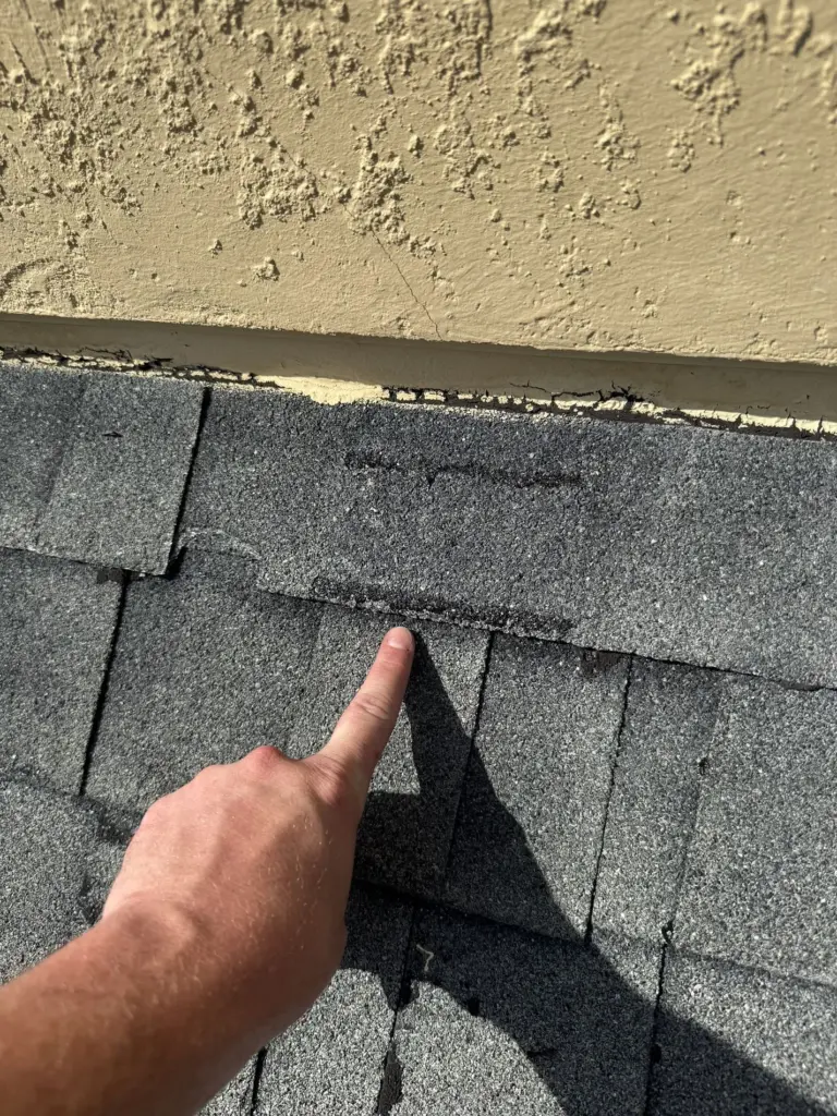 Roofing Projects FL 14 Storm-aged asphalt shingles documented before roof replacement in Iron Gate neighborhood, Leesburg, Florida