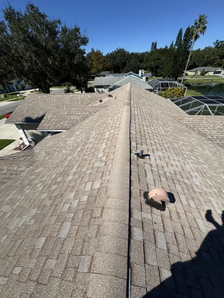 Storm-exposed aging roof on a home in Port Orange Florida before replacement
