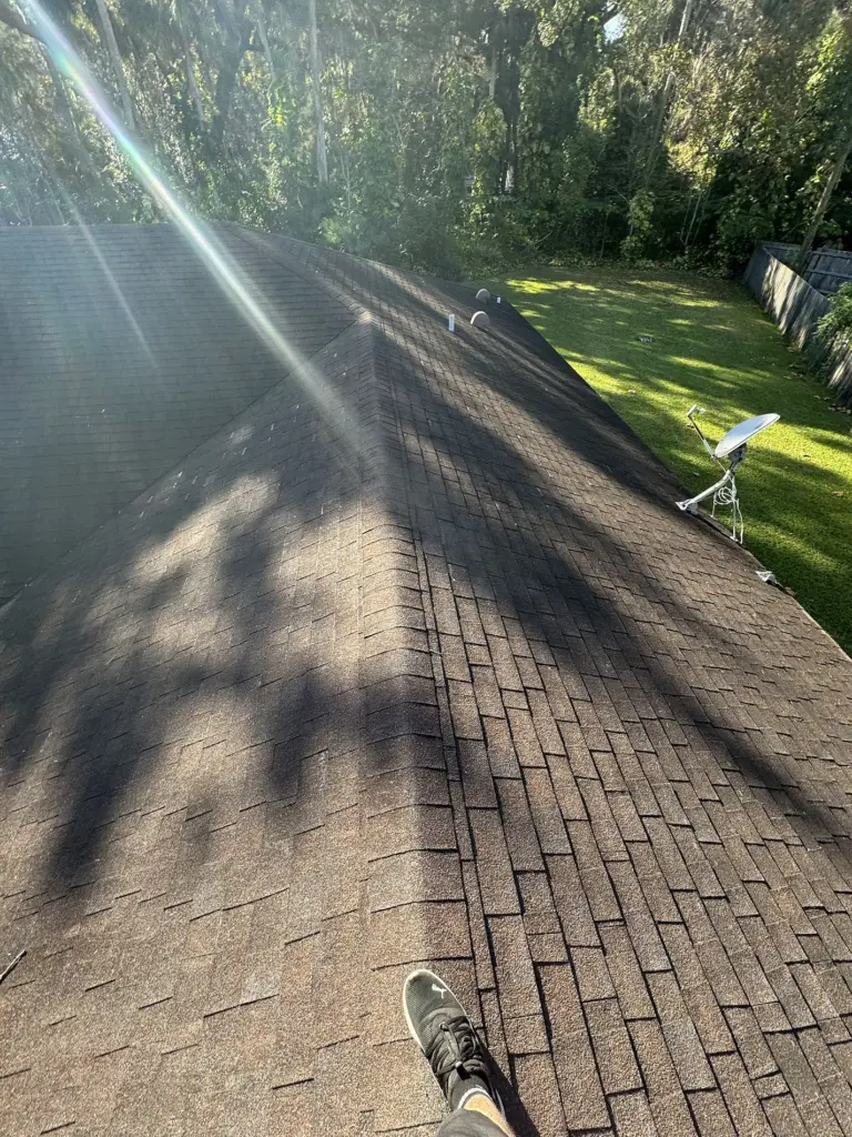 Roofing Projects FL 8 Roof ridge line view documenting existing shingle condition before replacement in Port Orange, Florida