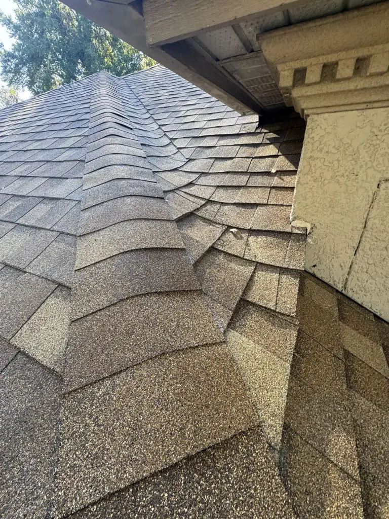 Ridge cap shingles installed on completed roof in Sanford, Florida