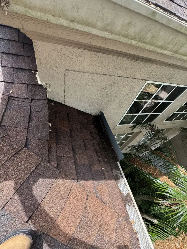 Roofing Projects FL 6 Roof valley area showing wear before roof replacement in Sanford, Florida