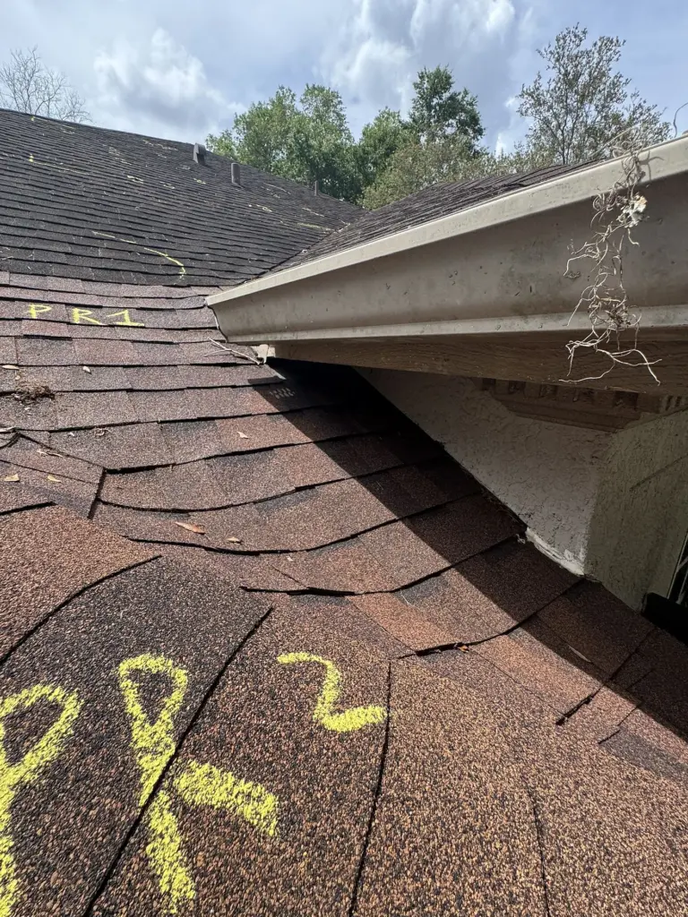 Roofing Projects FL 7 Roof ridge cap shingles documented before replacement in Sanford, Florida