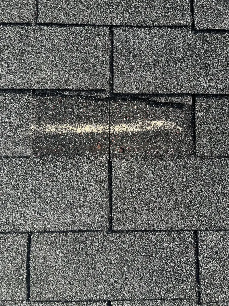 Close-Up of Weathered Shingles Before Roof Replacement in Daytona Beach FL