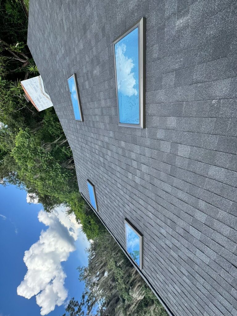 New Atlas Black Shadow shingles and skylight flashing on Orlando FL home