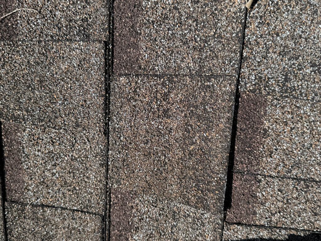 Damaged roof shingles before replacement in Orlando FL