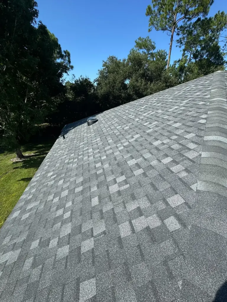 Completed Atlas Pinnacle Pristine Pewter roof with Integrity Roof Services sign in the Vineyards neighborhood of Port Orange, FL.