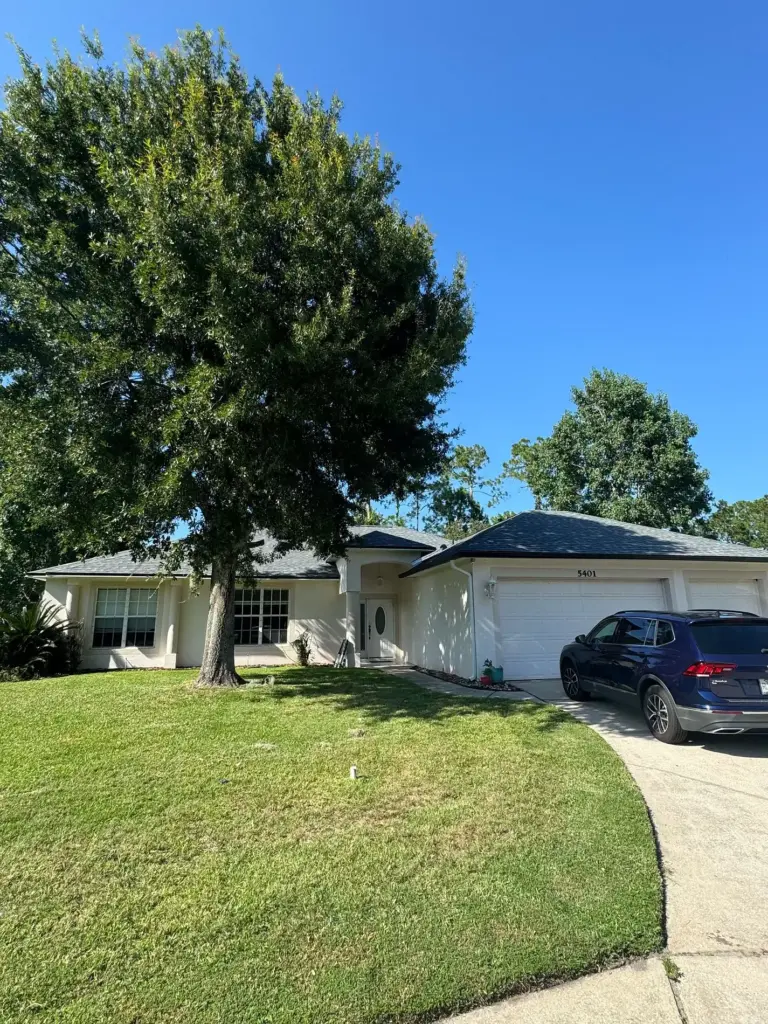 Completed Atlas Pinnacle Pristine Pewter hip-and-ridge shingles on Lancers Lane in Port Orange, FL.
