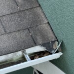 Gutter damage from falling debirs Before Integrity Roof Services Roof finished roof gutter front Tavares, FL