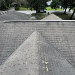 Home exterior before roof tear-off — original shingles nearing end of life, photographed prior to removal. Home exterior before roof tear-off — original shingles nearing end of life, photographed prior to removal.