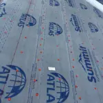 Installing Atlas Summit 60 Synthetic Underlayment — lightweight, slip-resistant, and water-repellent barrier applied to protect the deck from moisture. Installing Atlas Summit 60 Synthetic Underlayment — lightweight, slip-resistant, and water-repellent barrier applied to protect the deck from moisture.