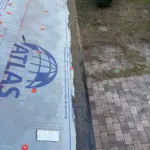 Aluminum drip edge installation along eaves with tar for sealing of nail holes— Aluminum drip edge installation along eaves with tar for sealing of nail holes—