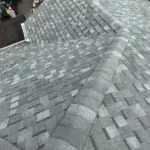 Completed ridge line and hip detail at an Integrity Roof Services project in Orlando, FL. Alt Text: After roof photo of ridge line and hip detail showing Atlas Pinnacle Pristine Coastal Granite shingles installed by Integrity Roof Services in Orlando, FL.