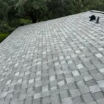 Completed front elevation at an Integrity Roof Services project in Orlando, FL, finished with Atlas Pinnacle Pristine Coastal Granite shingles. After roof photo of front elevation showing new Atlas Pinnacle Pristine Coastal Granite shingles installed by Integrity Roof Services in Orlando, FL.