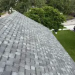 Completed front elevation at an Integrity Roof Services project in Orlando, FL, finished with Atlas Pinnacle Pristine Coastal Granite shingles. After roof photo of front elevation showing new Atlas Pinnacle Pristine Coastal Granite shingles installed by Integrity Roof Services in Orlando, FL.