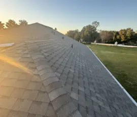 Final project photo showing completed Atlas Weathered Wood roof and Integrity Roof Services truck onsite in Mount Dora, FL Driveway view with Integrity Roof Services truck