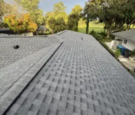Atlas Pro Cut Hip & Ridge installation in Pewter providing reinforced roof peaks and enhanced durability Atlas Pro Cut Hip & Ridge installation in Pewter providing reinforced roof peaks and enhanced durability