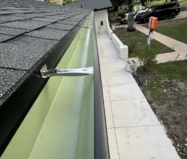 Integrity Roof Services professional install of the guuter edge showing correct overlap of shingles with flashing Integrity Roof Services professional install of the guuter edge showing correct overlap of shingles with flashing