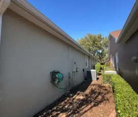 Post-hail replacement photo highlighting seamless gutter installation and new soffit supporting long-term roof performance in DeLand Post-hail replacement photo highlighting seamless gutter installation and new soffit supporting long-term roof performance in DeLand