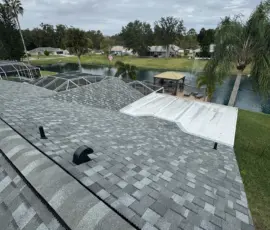Completed roof visible under clear daylight conditions. Finished roof replacement under daylight in Port Orange FL