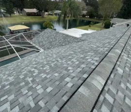 Finished roof surface showing straight shingle courses. Finished roof installation with straight shingle lines in Port Orange FL