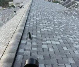 Upper roof plane showing completed shingle installation. Upper roof plane after roof replacement in Port Orange Florida