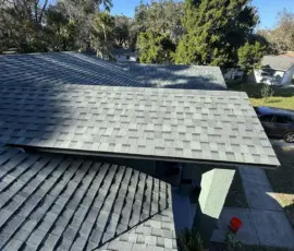 After close-up showing finished roof edge detailing on the completed system. Roof edge and shingle termination detail after installation in Port Orange, Florida