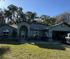 After photo showing the finished shingle field following roof replacement. Newly installed architectural asphalt shingles on a residential roof in Port Orange, Florida
