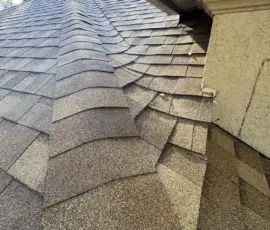 Close-up detail of ridge cap workmanship after installation. Ridge cap shingles installed on completed roof in Sanford, Florida