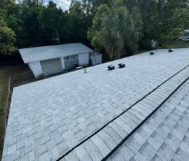 Atlas Pinnacle Pristine Oyster Shell roofing system installed with Atlas TruRidge ventilation on W Charlotte Ave. New Oyster Shell Atlas architectural shingle roof installed in Eustis Florida.
