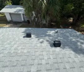 Beautiful completed roof replacement featuring Atlas Pinnacle Pristine Oyster Shell shingles. Integrity Roof Services Atlas Pinnacle Pristine roof replacement in Eustis FL.