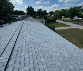 Full roof upgrade completed on W Charlotte Ave in Eustis, Florida using Atlas Pinnacle Pristine Oyster Shell architectural shingles. Finished residential roofing project on W Charlotte Ave using Atlas Oyster Shell shingles.