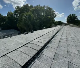 Finished Atlas roofing system installation featuring Oyster Shell architectural shingles and Atlas TruRidge ventilation. Atlas roofing system installed on W Charlotte Ave in Eustis FL by Integrity Roof Services.