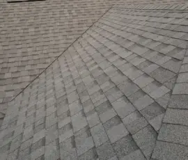 New Pewter Shingles Along Roof Ridge at Sunset Lakeland